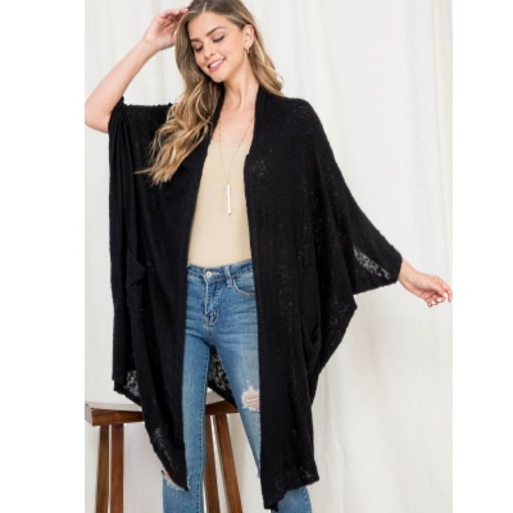 Wrap Yourself Up In This Wonderfully Cozy Oversized Cocoon Style Black Cardigan. Open Front With Dolman Style Sleeves And Slouchy Pockets. It's The Perfect Topper For Everything From Skirts To Pants To Pajamas. An Excellent Layering Piece For Travel Since It's Easy To Toss Into A Tote Bag. Lightweight Enough To Be Worn Year Round. One Size. Rayon/Poly/Viscose Fit Note: Due To The Dolman Sleeve/Cocoon Style Design Of The These Sweaters They Will Fit A Variety Of Sizes. They Look Just As Good On A Black One Size Casual Cardigan, One Size Black Casual Cardigan, Casual Black One Size Cardigan, Black Cozy Cardigan With Relaxed Fit, Black Oversized Open Front Cardigan, Oversized Black Open Front Cardigan, Black Casual Cardigan With Batwing Sleeves, Black Cozy Relaxed Fit Cardigan, Black Casual Batwing Sleeve Cardigan