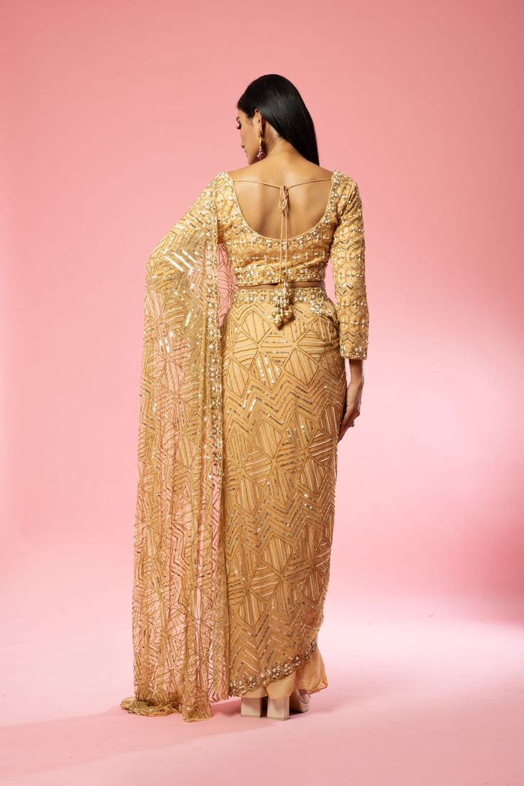 Featuring a golden pre-stitched saree made of pure georgette and net base with intricate hand-embroidery of pearl, sequin, cutdana beads, anchor thread, glass beads all over blouse and saree. Royal Blue Lehenga, Ruffle Lehenga, Stitched Saree, Raw Silk Lehenga, Anchor Threads, Yellow Lehenga, Blue Lehenga, Padded Blouse, Ivory Blouse