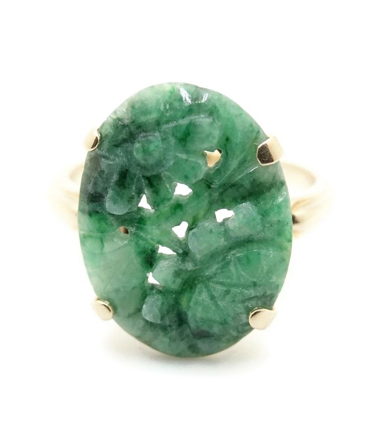 "Wear a beautiful art piece on your finger!  This pretty ring features jade carved into an ornate flower design.  The large oval cut jade is secured in a 14k gold prong setting.  The holes in the jade are part of the design work.  Gorgeous craftsmanship at its finest!  Ring size 9 METAL / MATERIAL - 14k Yellow Gold MARKINGS / HISTORY - Marked \"14K\" and the church symbol hallmark for Church & Co. CONDITION - Preowned.  Great condition. SIZE / MEASUREMENTS - Ring size 9.  Weighs 3.2 dwt (5 g).  Jade measures approx. 20 mm tall by 15 mm wide." Pretty Ring, Carved Jade, Diamond Cross Pendants, Circle Diamond, Jade Ring, Jade Carving, Pretty Rings, Cross Pendant Necklace, Metal Material