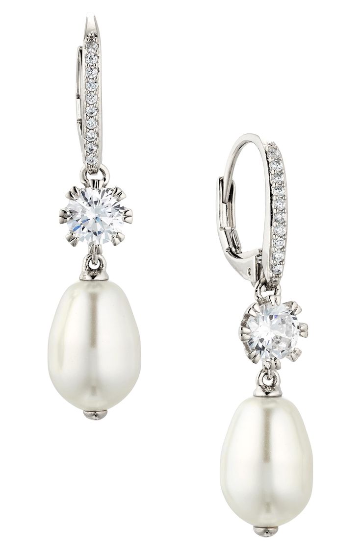 Lustrous imitation-pearl drops dangle from these cubic zirconia-illuminated earrings that add an elegant flourish to your special-occasion look. 1 1/4" drop; 1/4" width Lever-back closure Imitation pearl/rhodium plate/cubic zirconia Imported Silver Pearl Earrings, Pearl Earring, Pearl Drop Earrings, Wedding Looks, Silver Pearls, Pearl Drop, Wedding Earrings, Rhodium Plated, Cubic Zirconia