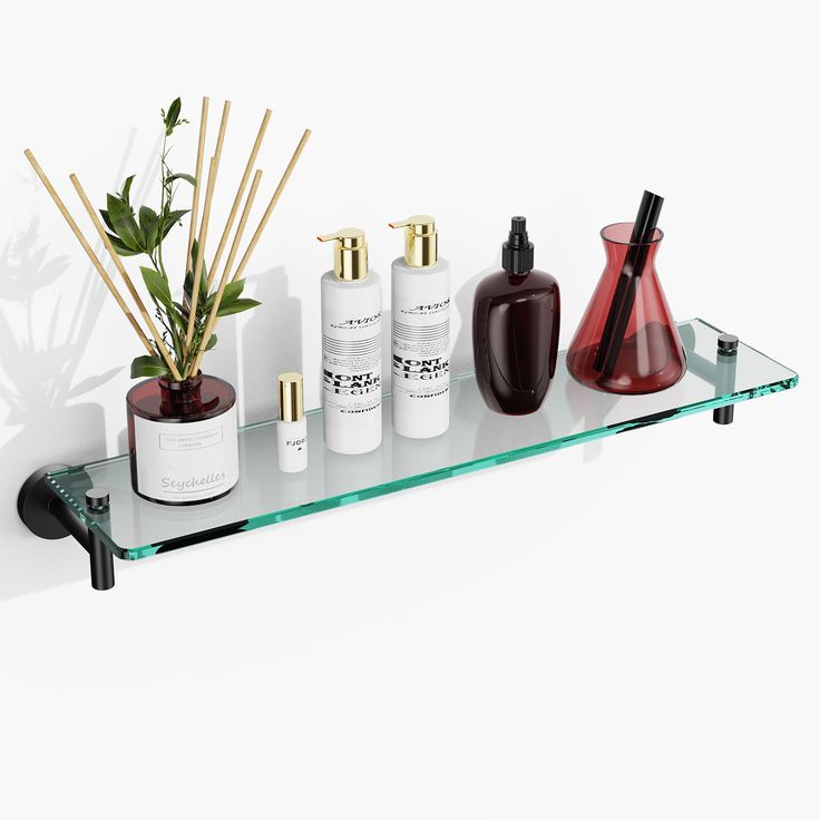 a shelf with some bottles and plants on it