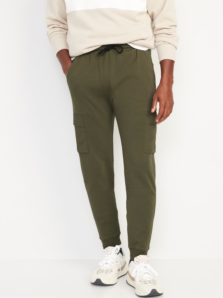 Level up your sweatpants game with Dynamic Fleece, a sleek, modern fabric that's made to move with you.  Elasticized rib-knit waistband, with adjustable drawstring.  Seamed back yoke for ease of movement.  Diagonal on-seam hip pockets, with light-reflecting bar tacks.  Hidden zippered stash pocket at left hip makes an ideal hiding spot for a key or card.  Woven nylon flap-patch cargo pockets at each leg.  Rib-knit cuffs.  Soft, breathable fleece lets you vent.  Four-way super stretch for ultimat Casual Joggers With Functional Pockets For Jogging, Sporty Cotton Joggers With Multiple Pockets, Casual Jogging Pants With Functional Pockets, Cotton Cargo Pants With Side Pockets For Sports, Casual Jogging Bottoms With Functional Pockets, Sporty Cotton Sweatpants With Functional Pockets, Fleece Sportswear Sweats With Side Pockets, Fleece Sportswear Activewear With Pockets, Fleece Sweats With Side Pockets For Sportswear