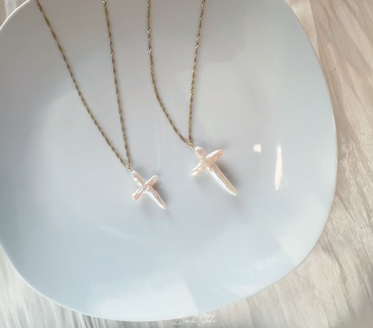 This necklace pairs a titanium steel chain with natural big freshwater cross pearl, exuding delicate elegance. The pearl boast high quality and a beautiful luster.  P E A R L ∙ N E C K L A C R ✨Pearl: Freshwater baroque pearls in cross-shaped ✨Titanium steel necklace（maximum length is 45cm, with a fixed length of 40cm and an adjustable length of 5cm.） ✨Pearl Color: natural untreated, metallic white with tint of pink overtone（The color of this sheen may vary）） O T H E R ∙ I N F O R M A T I O N ✨ Pearl Chain Cross Pendant Necklace Gift, Gift Pearl Chain Cross Pendant Necklace, Pearl Chain Cross Necklace Gift, Pearl Chain Cross Necklace As Gift, Gift Pearl Pendant Cross Necklace, Gift Cross Necklace With Pearl Pendant, Pearl Drop Cross Necklace Gift, Cross Pendant Necklace With Pearl Drop Gift, Silver Cross Necklace With Pearl Chain As Gift