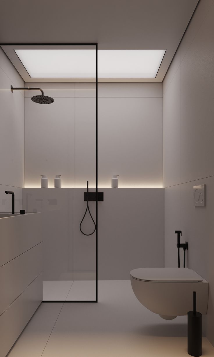 a modern bathroom with white walls and flooring, along with a large bathtub