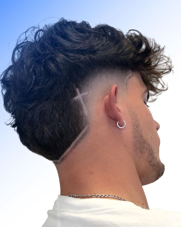 Curly Mohawk Fade with Shaved Lines Fade Haircut Line Design, Burst Fade With Cross Design, Mens Burst Fade Haircut Short, Fade Lines Haircut, Hair Lining For Men, Men Haircut With Design, Burst Fade Mohawk With Design, Line In Haircut Men, Hair Line Designs For Men