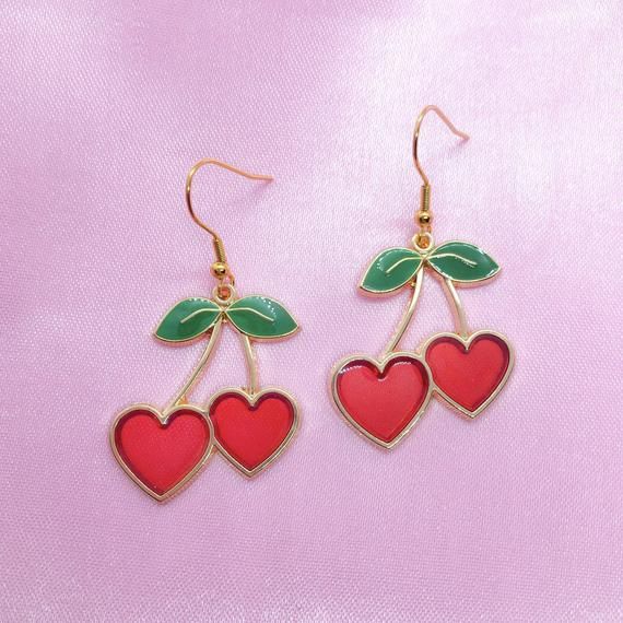 This listing is for a pair of cherry charm earrings with hypoallergenic gold plated hooks. Great for sensitive ears! Earrings are about 2” in total length. Cherry Earrings Aesthetic, Handmade Cute Cherry Earrings, Handmade Cherry Cute Earrings, Trendy Cherry Dangle Earrings, Cute Cheap Cherry-colored Earrings, Cherry Charm, Bing Cherries, Jewelry Care Instructions, Silver Plated Jewelry