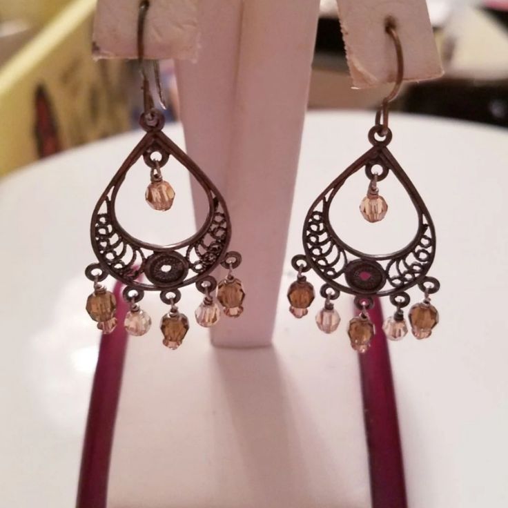 Nwot. Brown And Champagne Jeweled Dangle Earrings For Pierced Ears. The Detail In The Metal Is Very Intricate And Beautiful. In Perfect Condition Without Any Flaws Or Jewels Missing. All Reasonable Offers Will Be Considered. Brown Metal Dangle Earrings, Elegant Brown Beaded Dangle Earrings, Brown Dangle Metal Earrings, Elegant Brown Chandelier Earrings With Dangling Beads, Brown Dangle Earrings For Party, Elegant Brown Earrings With Dangling Beads, Elegant Brown Chandelier Earrings, Elegant Brown Dangle Earrings, Brown Pierced Metal Earrings