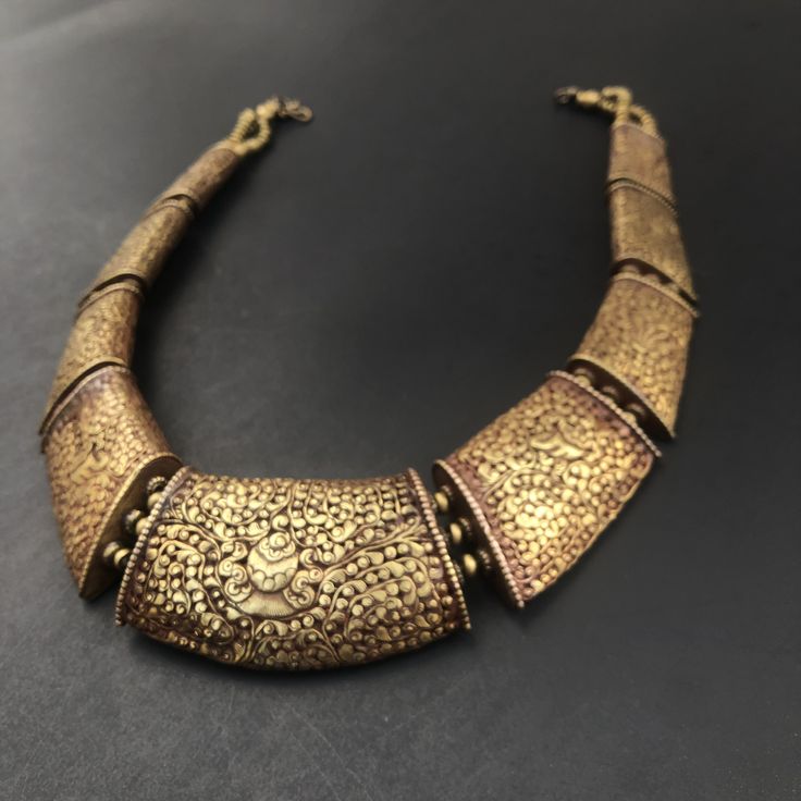 Fine example of Tibetan carving of Ashtamangala necklace in antique brass finish  Approximate length is 18-20 inches , Approximately 1.5 inches wide The Ashtamangala is a sacred suite of Eight Auspicious Signs endemic to a number of religions such as Hinduism, Jainism, and Buddhism Antique Gold Necklace For Diwali Festive Season, Antique Gold Temple Jewelry Necklace For Festive Season, Gold Temple Necklace With Antique Finish For Festive Occasions, Festive Antique Gold Necklaces For Diwali, Festive Gold Temple Necklace With Antique Finish, Festive Antique Gold Necklace For Diwali, Festive Antique Gold Temple Jewelry Necklace, Traditional Antique Gold Festive Necklace, Antique Gold Temple Necklace With Intricate Design As Gift