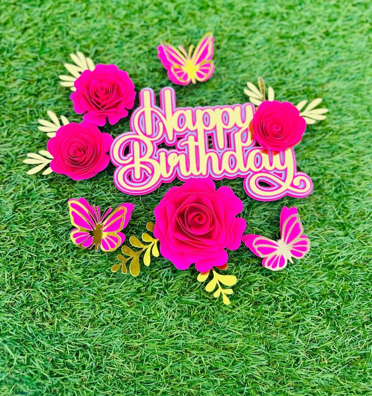 a birthday card with roses and butterflies on the grass