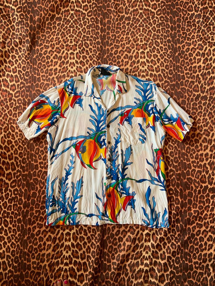 Vintage Hawaiian Shirt I've provided pictures in listing with measurements, click on pictures to enlarge & see details.  pictures with measurements so you can see exactly where measurements are taken.  Click on pictures to enlarge,  For circumference, double listed measurements. Check measurements on listing carefully. Compare against a piece of clothing that fits you well. Keep in mind Vintage sizes run differently than modern sizes, so check measurements.  ⭐️I apologize, however I do not accep Hawaiian Collared Top With Graphic Print, Hawaiian Collared Tops With Graphic Print, White Camp Collar Top With All Over Print, Collared Tops With All Over Print For Vacation, Hawaiian Tops With All Over Print And Camp Collar, Hawaiian Tops With Camp Collar And All Over Print, Hawaiian Camp Collar Top With All Over Print, Collared Graphic Print T-shirt For Vacation, Hawaiian Graphic Print Top With Camp Collar