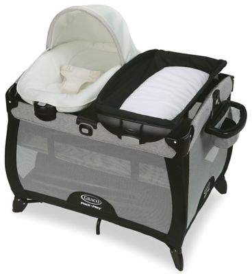 the graco travel crib is shown in black and grey with white trims