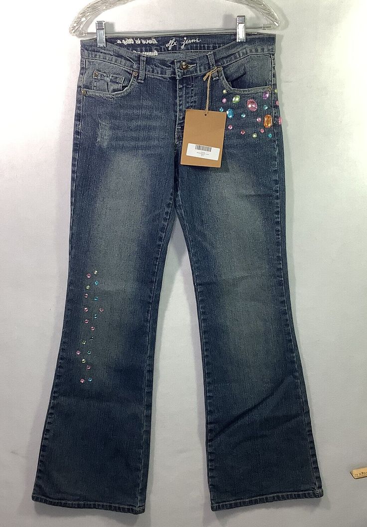 Step out in style with these DFX Junior Jeans Flare Denim Pants. These trendy pants have a mid-rise waist and wide legs perfect for any season. The beaded accents add a touch of glam to the solid blue color, making them suitable for casual occasions. These pants come in size 9 and are made of high-quality denim material, ensuring durability and comfort. The zip and button closure makes them easy to wear, and the flared leg style adds a fashionable twist. Shop for these amazing trousers from the Junior Jeans, Trendy Pants, Color Making, Denim Material, Juniors Jeans, Dream Girl, Cute Jeans, Denim Flares, Wide Legs