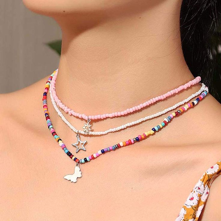 PRICES MAY VARY. Multicolor Necklace Material: Beads and alloy. Our Products will bring you more comfortable feeling. Layering Pendant Necklace Size: The first layer: 41cm/16inch. The second layer: 41cm/16inch. The third layer: 41cm/16inch. Suitable for most people because of adjustable extended chain. Colorful Beaded Necklace: So cute and trendy. Especially multilayer colorful beaded chain combined, pink flower chain, white star chain and colored butterfly chain, adding more vitality sense. Ide Minimalist Accessories Jewellery, Beach Costume, Chain Necklace Diy, Colorful Bead Bracelets, Layered Beaded Necklaces, Diy Beaded Rings, Choker Chain, Necklace Colorful, Pendant Choker