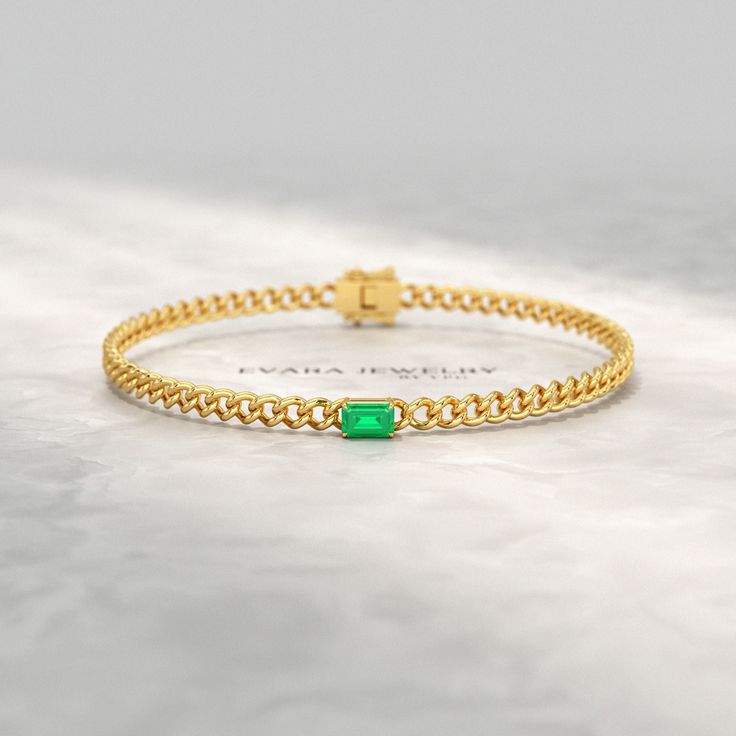 Elevate your style with this stunning Natural Emerald Cuban Chain Link Statement Bracelet in 14K Yellow Gold. Perfect for graduation gifts or personalized jewelry, this Cuban curb chain bracelet features a vibrant emerald centerpiece. Luxurious and eye-catching, this 14K yellow gold chain bracelet is sure to make a statement. 𝐅𝐞𝐚𝐭𝐮𝐫𝐞𝐬: * 𝐌𝐚𝐝𝐞 𝐭𝐨 𝐎𝐫𝐝𝐞𝐫 * 𝐌𝐞𝐭𝐚𝐥: 𝟏𝟎𝐊 𝐆𝐨𝐥𝐝 | 𝟏𝟒𝐊 𝐆𝐨𝐥𝐝 | 𝟏𝟖𝐊 𝐆𝐨𝐥𝐝 | 𝟗𝟓𝟎 𝐏𝐥𝐚𝐭𝐢𝐧𝐮𝐦 * 𝐁𝐚𝐧𝐝 𝐂𝐨𝐥𝐨𝐫𝐬: Rose Gold, Elegant Cuban Link Bracelets For Anniversary, Yellow Gold Bracelets For May Birthstone, 14k Gold Bracelet For Formal Occasions With May Birthstone, Yellow Gold Emerald Bracelet For Formal Occasions, Formal 14k Gold Bracelet With May Birthstone, Formal Yellow Gold Bracelets For May Birthstone, Formal Yellow Gold Bracelet With May Birthstone, Gift Diamond Bracelet With Curb Chain, Elegant Gold Cuban Link Bracelet For Anniversary