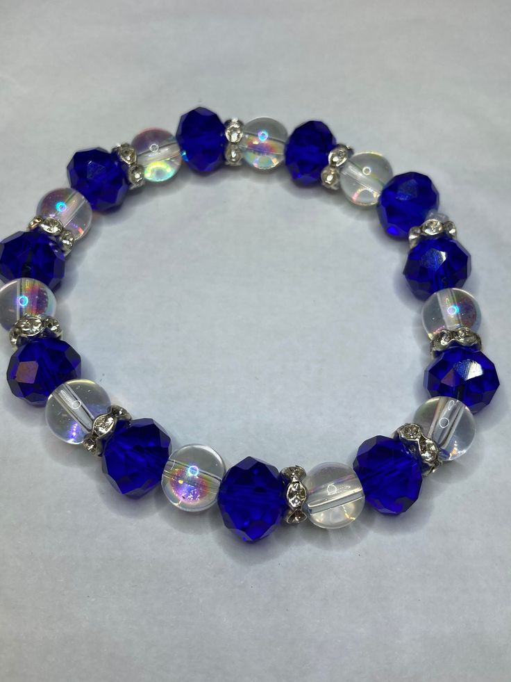 a bracelet with blue and clear glass beads