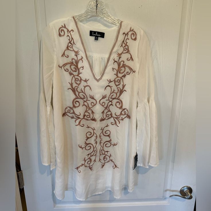 Lulus Beauty And The Beach Ivory Embroidered Long Sleeve Dress Sz Xs New W Tags White Embroidered Mini Dress For Brunch, White Long Sleeve Dress For Holiday, White Embroidered Dress For Holidays, White Flowy Embroidered Dress For Spring, White Embroidered Flowy Dress For Spring, Elegant White Mini Dress For Holiday, White Embroidered Holiday Dress, White V-neck Embroidered Dress For Brunch, White Flowy Dress With Bell Sleeves