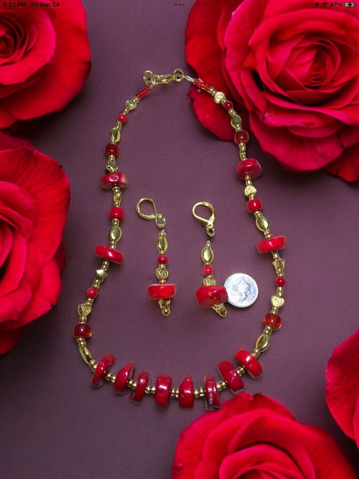 If you're looking for a beautiful, unique gift for your loved one, look no further than this natural red coral gold necklace! Made from real red coral beads affordable and hand-crafted this 18 inch necklace is the perfect way to show her how much you care. The matching earrings are 2 1/2 inches long and long lasting gold plated. Whether she's celebrating an anniversary or just want to make her feel special, this necklace is sure to be a hit. So don't wait any longer - order your necklace today. Comes in a pretty gift box and free shipping! Red Jewelry Sets With Round Beads For Gift, Red Adjustable Round Jewelry Sets, Red Polished Beads Round Jewelry, Elegant Red Beaded Necklace With Lobster Clasp, Red Coral Round Beads For Jewelry Making, Elegant Red Coral Jewelry With Gemstone Beads, Elegant Red Gemstone Beads Jewelry, Elegant Red Jewelry With Gemstone Beads, Adjustable Red Coral Jewelry For Jewelry Making