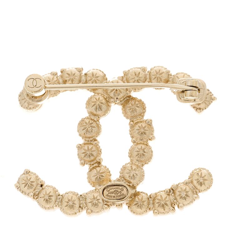 This is an authentic CHANEL Pearl Crystal CC Brooch in Gold, Pearly White, and Purple. This elegant brooch features a gold Chanel CC logo with pearly white resin pearls and purple crystals. Cc Brooch, Elegant Brooch, Chanel Pearl, Chanel Pearls, Gold Chanel, Pearl Crystal, Purple Crystals, Cc Logo, Pear