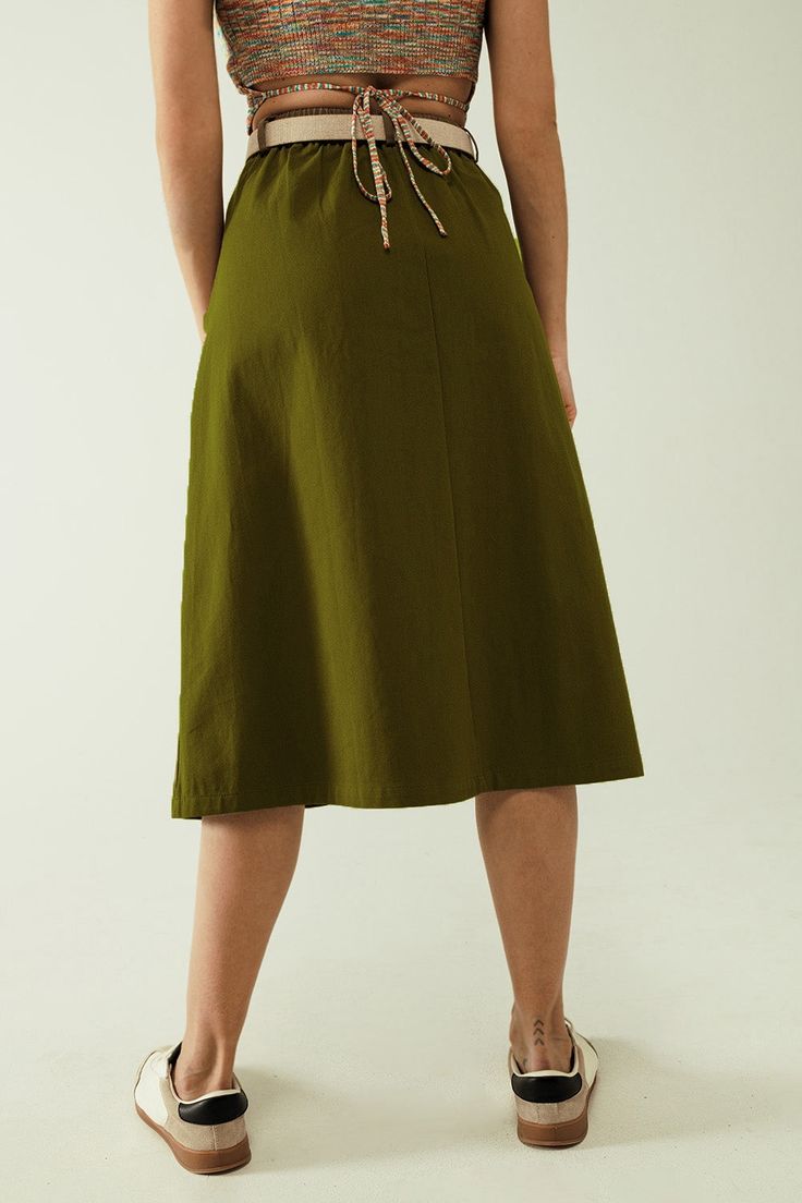 Step into effortless style with our A-Line Midi Khaki Skirt, a versatile piece perfect for any casual occasion. Made from 100% cotton, this skirt offers both comfort and durability. The high waist and regular fit provide a flattering silhouette, while the midi length adds a touch of elegance. Equipped with side and back pockets, this skirt combines functionality with fashion. The zip fastening ensures a secure and comfortable fit, making this skirt a must-have in your wardrobe. Model Info: Model Khaki Skirt, Skirt With Pockets, Skirt Style, Skirts With Pockets, Estilo Casual, Fabric Cotton, Midi Length, Effortless Style, Casual Style