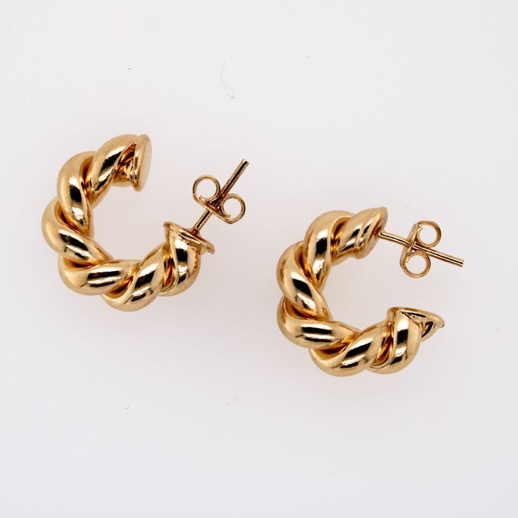 Named after our mother/grandmother, the Barbara earrings are a modern take on a pair of her much loved hoops. Two intertwined polished gold strands create the classic circular shape. **Gold filled 14k gold over brass. *Waterproof. 3 Sizes Barbara diameter is 1.25" Mini Barbara diameter is .75" Huggie diameter is .50" *Waterproof but will be damaged by chlorine and harsh liquids. **Our gold filled earrings have layers of 14k gold over brass. They have the look and color of solid gold earrings and Twisted 14k Yellow Gold Earrings, Twisted Yellow Gold Hoop Earrings, Tarnish Resistant, Twisted Gold Plated Yellow Gold Hoop Earrings, Modern Twist Round Earrings, 14k Yellow Gold Twisted Earrings, Elegant Twisted Yellow Gold Earrings, Modern Twist Gold Huggie Hoop Earrings, Modern Twist Tarnish Resistant Twisted Earrings, Modern Twist Everyday Earrings