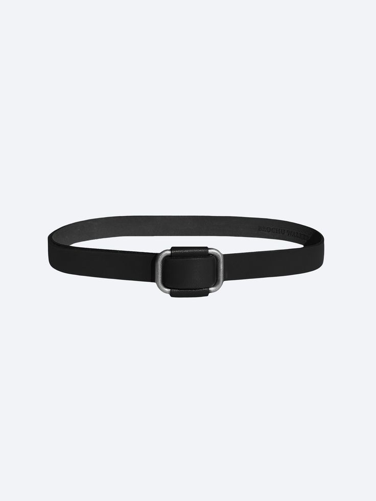 Saddle black leather buckle belt front view Sleek Leather Belts For Office, Sleek Leather Office Belt, Modern Leather Belt Buckles, Modern Leather Belt Buckles For Office, Sleek Leather Belt Buckles For Workwear, Modern Belt Buckles With Removable Belt For Office, Modern Leather Belt For Everyday, Designer Black Belt With Buckle Closure, Designer Black Belt With Buckle