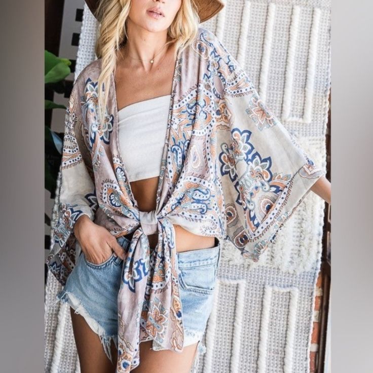 New Beautiful Bohemian Paisley Top From Bucket List. Featuring A Relaxed Oversized Fit. Kimono Sleeves With An Adjustable Front Tie Closure. Reverse Print Fabric. Size: Medium M Brand New In Packaging One Size Long Sleeve Beach Cover-up Top, Flowy Open Front Top For Spring, Cream Top For Spring Beach Cover-up, Casual Open Front Blouse For Spring, Casual Spring Blouse With Kimono Sleeves, Casual Flowy Open Front Top, Flowy Casual Open Front Tops, Casual Blouse With Kimono Sleeves For Spring, Flowy Open Front Casual Top