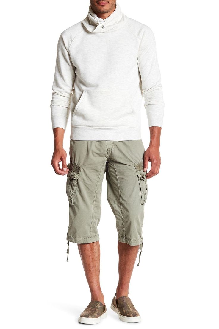 Style an on-trend look in cargo shorts crafted from breathable cotton for comfort during casual outings. 18" inseam; 10" front rise (size 32) Zip fly with button closure 100% cotton Machine wash, tumble dry
 Imported Model stats: 6'1" height, 32" waist. Model is wearing size 32. Casual Relaxed Fit Cargo Pants With Built-in Shorts, Relaxed Fit Cargo Shorts With Cargo Pockets, Casual Khaki Bermuda Bottoms, Casual Khaki Bermuda Shorts, Casual Bermuda Shorts In Khaki, Relaxed Fit Bermuda Cargo Bottoms, Casual Bermuda Khaki Shorts, Khaki Cotton Knee-length Bermuda Shorts, Spring Cargo Style Knee-length Shorts