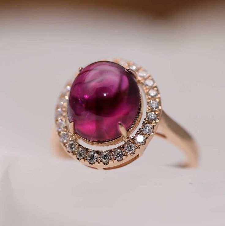 10.5x9.5mm Natural Purple-Red Touname Ring, Oval Cabochon Tourmaline Ring with Real Natural Diamond Halo, 18K solid Rose Gold Gemstones: Natural Tourmaline, Diamonds Size: 10.5 x 9.5 x 4.96mm Metal: 18k Solid Rose Gold 》Packaging 《 All jewelry is packed by me in an elegant Gift Box. 》How we ship《 - FREE PRIORITY SHIPPING - United States delivery will take 3-10 Days after Shipment. - Other countries delivery will take 5-15 Days after Shipment. I hope all of your questions are answered to your sat Rose Gold Ruby Ring Oval, Fine Jewelry Ruby Oval Cabochon Ring, Oval Cabochon Ruby Ring For Anniversary, Oval Ruby Ring In Rose Gold With Bezel Setting, Oval Ruby Ring With Gemstone Accents, Rose Gold Oval Cabochon Ring, Rose Gold Cabochon Oval Rings, Rose Gold Oval Cabochon Gemstone Ring, Oval Tourmaline Ruby Ring For Formal Occasions