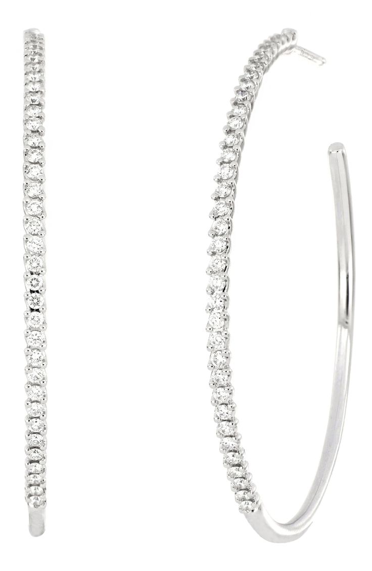 Diamonds give the classic hoop style a glistening update in these 18-karat white-gold earrings that transition effortlessly from day to night. 1 3/4" drop Post back Total diamond weight: 0.78ct. Color: G Clarity: VS 18k gold/diamond Imported >Diamond Guide Classic Platinum Hoop Earrings In White Gold, Elegant Pave Set Hoop Earrings, Dazzling Small Hoop White Gold Earrings, Elegant Hoop Earrings With Brilliant Cut, Dazzling White Gold Small Hoop Earrings, Elegant Hoop Earrings With Pave Setting, Everyday Luxury White Gold Hoop Earrings With Pave Setting, Modern White Gold Hoop Earrings With Pave Setting, Dazzling Hoop Earrings With Pave Setting For Formal Events