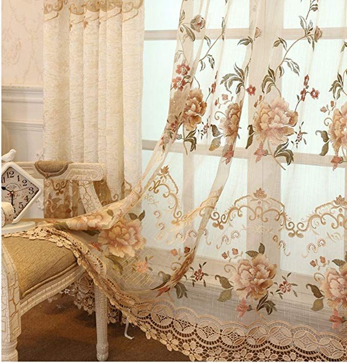 the curtains in this room are decorated with flowers and lace trimmings on them