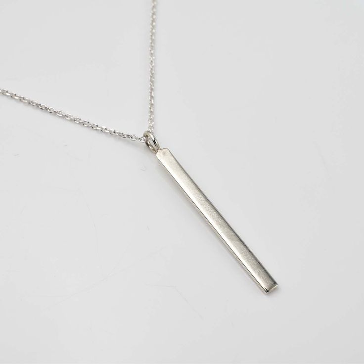 Personalize your style with the Engravable Silver Bar Necklace ✨💖! This elegant accessory features a sleek silver bar that can be customized with your special message or date. 💫 Perfect for any occasion, its minimalist design complements any outfit with modern flair. Crafted with high-quality materials for durability, the adjustable chain ensures a comfortable fit. 💕 Treat yourself or a loved one to this timeless accessory that will be cherished for years to come! 💖 Elegant Silver Rectangular Bar Necklace, Classic Silver Bar Necklace, Modern Sterling Silver Bar Necklace, Classic Silver Bar Necklace As A Gift, Classic Sterling Silver Bar Necklace, Modern Sterling Silver Bar Necklace As Gift, Modern Sterling Silver Bar Necklace For Gift, Simple Silver Necklace With Rectangular Pendant, Silver Engraved Rectangular Bar Necklace