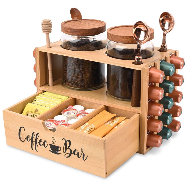 the coffee bar is made out of wood and has cups, spoons, bowls, and other items in it