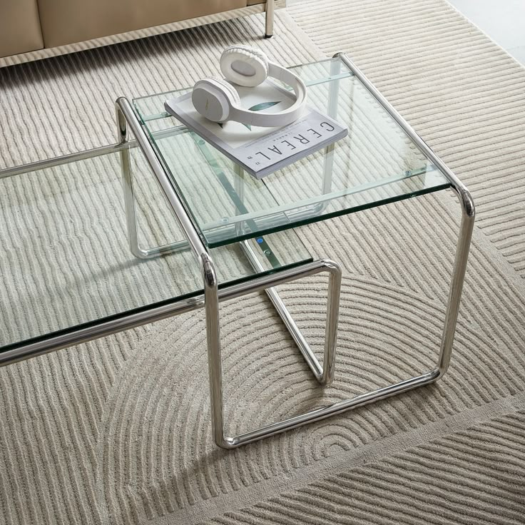 a glass coffee table with headphones on top