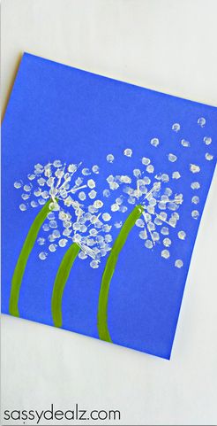 a blue card with three dandelions on it