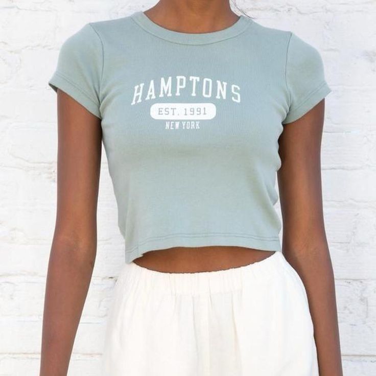 Nwot Brandy Melville John Galt Sage Green Hamptons Cropped Baby Tee Brand New. 100% Cotton Super Soft And Stretchy Comfortable Little Graphic Baby Tee That Has White Letters That Read Hamptons Going Across The Front. Super Cute With Some Sweats Or Mom Jeans. Love The Fit And The Color Fitted Green Tops With Letter Print, Green Fitted Top With Letter Print, Blue Cropped T-shirt With Letter Print, Fitted Light Blue Tops With Letter Print, Fitted Blue Crop Top With Graphic Print, Trendy Light Blue Crew Neck Crop Top, Light Blue Fitted Crew Neck Tops, Basic Letter Print Tops For Spring, Blue Letter Print Crop Top