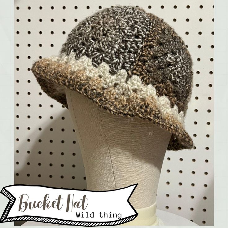 Handcrafted and truly one of a kind, this trendy speckled brown granny square bucket hat adds a touch of whimsy and warmth to any outfit. Perfect for those who love unique, handmade accessories! Made and ready to ship! Only 1 so get it before it's gone. Material is stretchy Fits head sizes - 19-22" Laid flat dimensions- 13" wide x 8" height Non-Return Policy: Thank you for choosing my handmade item! I take great pride in crafting each piece with care and attention to detail. As a small business, I appreciate your support and understanding of my store policies. Due to the unique nature of handmade items, I regret to inform you that I  am unable to accept returns or exchanges. In the rare event that your item(s) arrive(s) damaged or defective, please notify me within 5 days of receiving your Brown Crochet Hat With Curved Brim For Fall, Brown Crochet Hat With Short Brim, Brown Hand Knitted Hat One Size, Brown Brimmed Cloche Hat One Size, Brown Brimmed Cloche Hat, One Size Fits Most, Brown Brimmed Cloche Hat, Brown Bohemian Crochet Hat, Bohemian Brown Crochet Hat, Brown Yarn Brimmed Hat