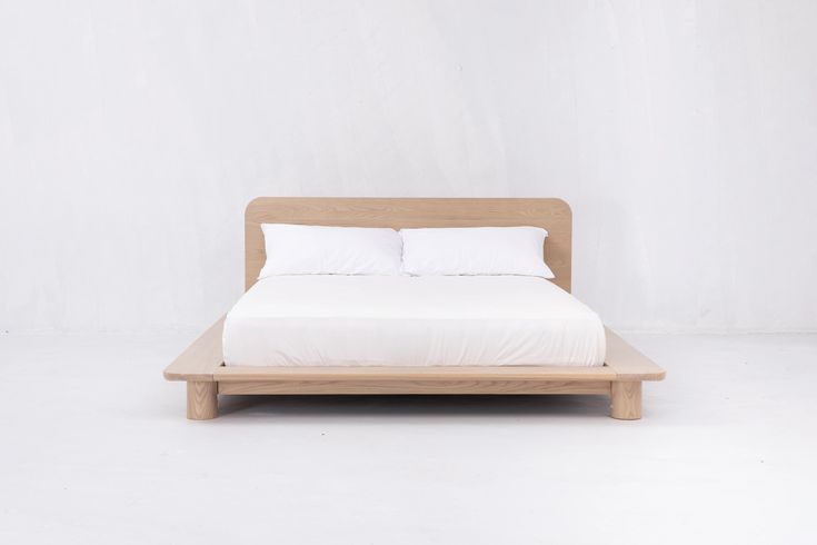 the bed is made up and ready for someone to use it in their home or office