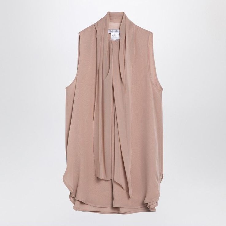 Powder-Coloured Silk Georgette Sleeveless Blouse By Max Mara Features A Fluid Design, A Ruffled Collar Motif With A Wide Bow Tie, Small Side Slits And A Button Fastening At The Front. Model Wears Size 40 It Model Measurements: Height: 176cm Chest: 86 Cm Waist: 64 Cm Hips: 89 Cm Size Type: It Material: Silk Sku: 2f-Melasi/P_maxm-020_102 Welcome To The Official Luosophy Poshmark Closet! Luosophy Is A Luxury Brand Reselling Company Founded In San Diego, Ca From 2016. All Our Products Are Imported F Feminine Silk Sleeveless Tank Top, Chic Viscose Sleeveless Tank Top, Chic Sleeveless Viscose Tank Top, Spring Silk Sleeveless Vest, Sleeveless Silk Summer Vest, Chic Silk Sleeveless Tank Top, Silk Sleeveless Summer Vest, Elegant Sleeveless Spring Blouse, Sleeveless Silk Tops