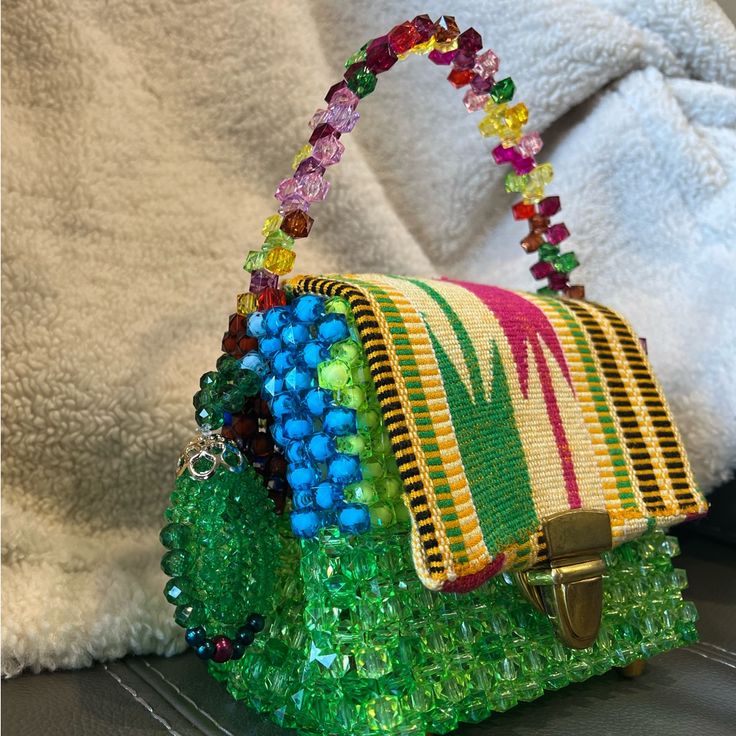 This Is A Beaded Bag With Fine Kente This Bag Is Home Made And It Takes 1 Day To Make One Bag This Bag Has Never Been Used So Please Help Support My Tiny Business It's Perfect If You Want Something To Make Your Outfit Pop. It's Also A Little Clear Sea Through Yellow Crossbody Bag As Fashion Accessory, Trendy Multicolor Beaded Bags, Green Beaded Bag For Summer, Green Beaded Rectangular Bag, Summer Green Beaded Bag, Yellow Satchel Bags, Green Square Bag For Fashion, Green Beaded Bags For Daily Use, Green Beaded Shoulder Bag For Everyday Use