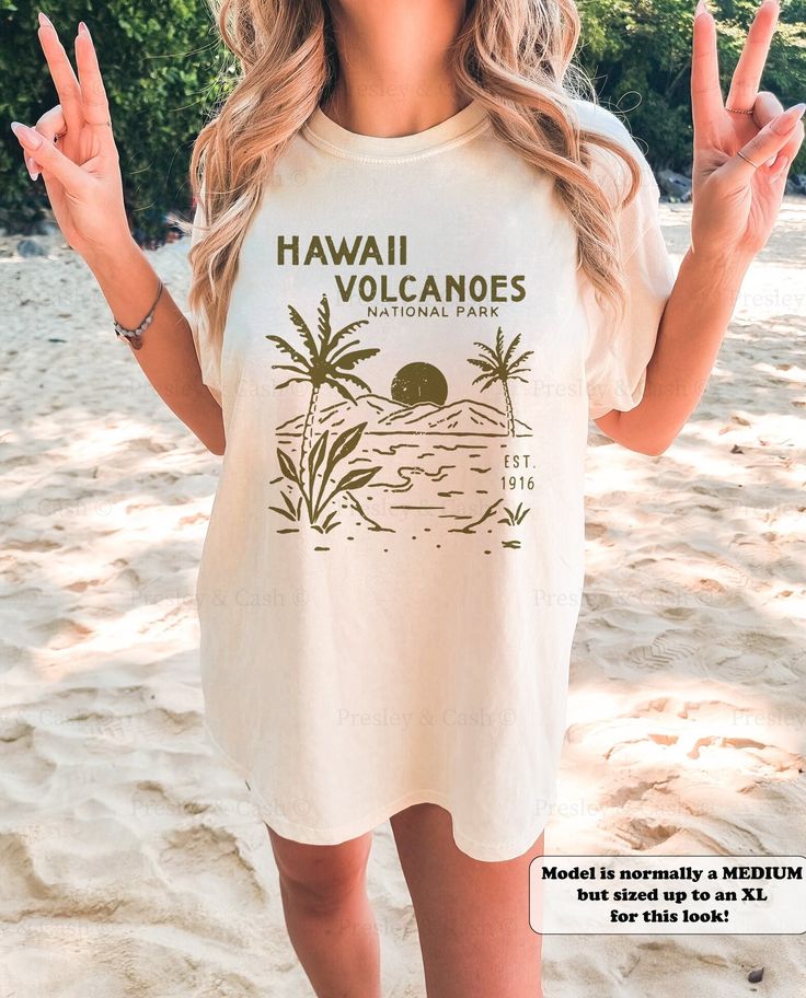 This trendy Hawaii beach shirt is the perfect cover up for warm summer days! Made from Comfort Colors fabric, it features a fun coconut girl and palm tree print that is sure to make any surfer girl happy. ⭐️ * I T E M * I N F O* ✦ Comfort Colors Unisex Shirt ✦ 100% Ring-Spun Cotton ✦ Printed using Direct To Garment style- Inks are printed directly into the fabric. ✦ Different sizing may effect placement of final design. ✦ Colors may differ slightly due to different user monitor and screen settin Summer Hawaiian Cotton Shirt With Letter Print, Summer Cotton Hawaiian Shirt With Letter Print, Summer Casual Hawaiian Shirt With Crew Neck, Casual Crew Neck Hawaiian Shirt For Summer, Trendy Relaxed Fit Hawaiian Shirt For Vacation, Trendy Relaxed Fit Hawaiian Shirt For Summer, Relaxed Fit Beachwear Shirt For Vacation, Trendy Hawaiian Shirt For Vacation, Trendy Hawaiian Shirt With Short Sleeves For Vacation