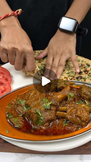 a person cutting up food on top of a plate