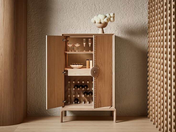 a cabinet with wine glasses and bottles in it