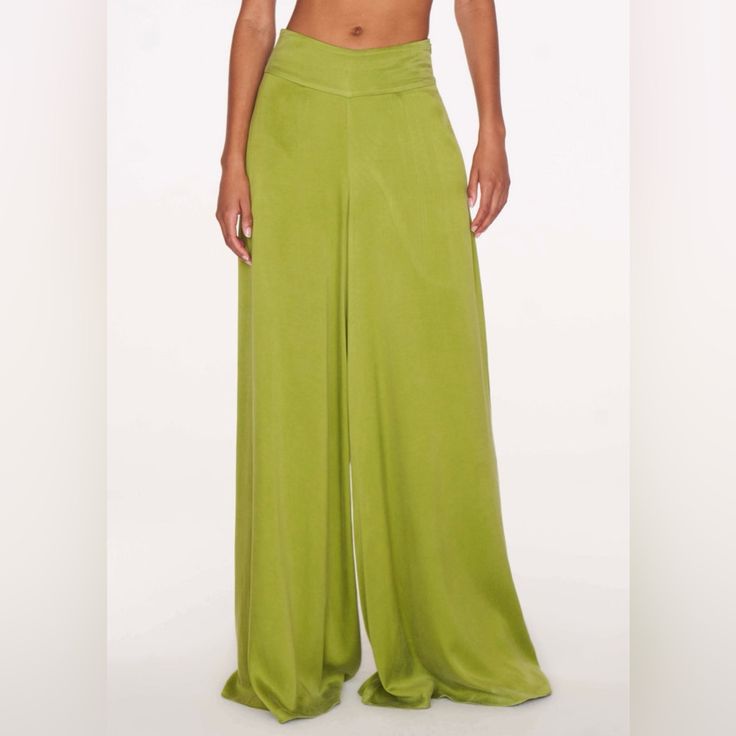 Cool, Contemporary And Crafted In A Fresh Shade Of Green, The Fluid Marlowe Trousers Radiate Effortless Elegance. Cut To A Flattering, Relaxed Fit With A High Waist And A Wide-Leg, Floor-Skimming Silhouette, They're The Embodiment Of Streamlined Simplicity And Set To Be A Hard-Working Wardrobe Essential. - Zip Fastening -Wide Leg High Waist Green Bottoms For Evening, Green Wide Leg Pants For Evening, Evening Green Trousers, Silk Bottoms For Summer Evenings, Green Bottoms For Summer Evening Wear, Green Wide-leg Pants For Evening, Green Pants For Evening And Summer, Green Evening Pants For Summer, Green Summer Evening Pants