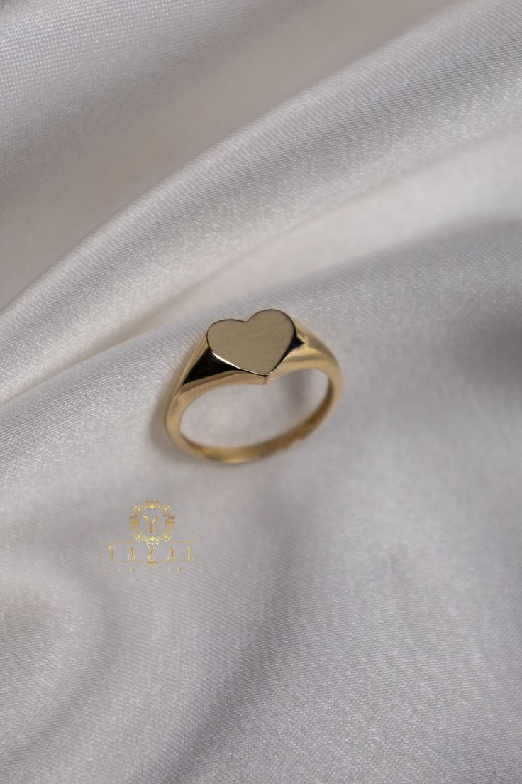 "ABOUT PRODUCT This 14K Gold Heart Ring is beautifully designed and hand crafted with our associates to make this a special gift for your loved ones. Knowing the value of our customers, We prepare each piece with extra care and attention.  ITEM DETAILS Material: 14K Gold Approx:  2.30 gram Available colors: Gold, Rose Gold, White Gold Available Sizes:  3 US to 10 US Sizes ✪ 14k Solid Gold ( Certification will be included with your order ) ✪Available 14K White, Yellow, Rose Gold (also in 10, 18K) 14k Gold Heirloom Heart Promise Ring, Heirloom 14k Gold Heart Promise Ring, 14k Gold Stackable Rings With Heart Charm For Gift, Elegant 14k Stamped Signet Ring For Valentine's Day, Elegant Signet Ring For Valentine's Day Gift, Elegant Engraved Signet Ring For Valentine's Day, Yellow Gold Signet Ring For Valentine's Day Gift, Simple Design Jewelry For Valentine's Day Anniversary, Valentine's Day Anniversary Polished Signet Ring