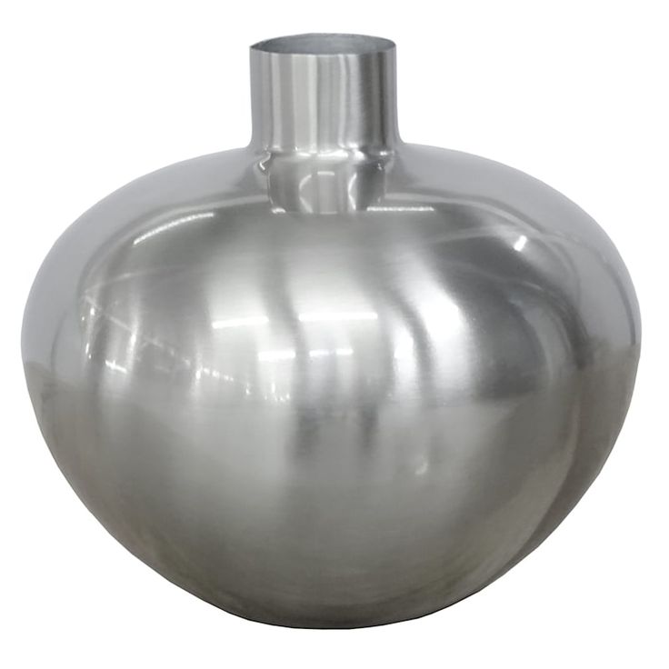 a large metal vase sitting on top of a white surface