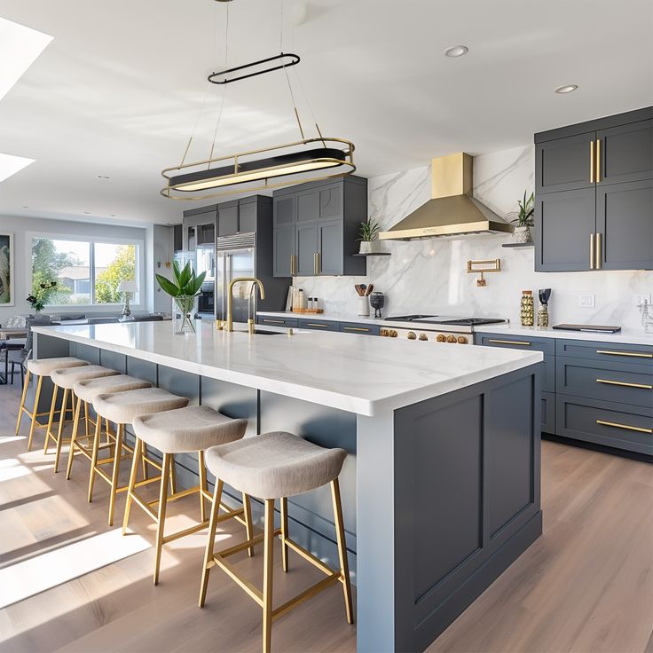 a large kitchen with an island and bar stools in the center, along with several chairs