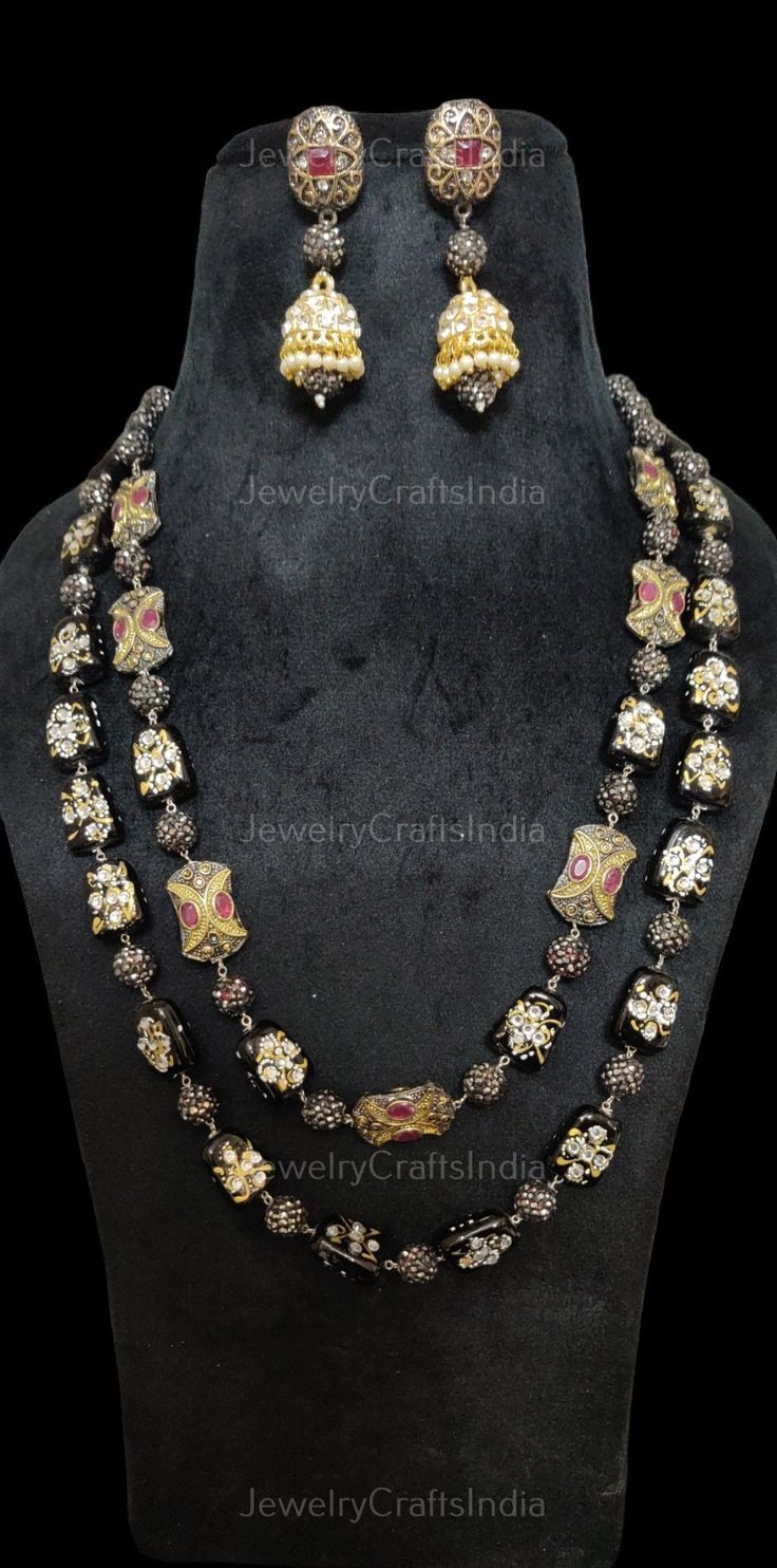 Multi Strand Necklace || Baroque Pearl Necklace || All Occasion Wear Mala || Kundan long Necklace || Long Indian Necklace Oxidized beaded necklace with hand painted pearls and kundan studs earrings. Necklace Length: 21 inches Highest quality and craftsmanship Customized orders takes 3 to 4 weeks, depending on piece requirements. Free shipping in US is Standard shipping. It takes 15-20 days . Express shipping charges extra. Meenakari Black Jewelry For Gift, Black Meenakari Jewelry As Gift, Black Meenakari Jewelry Gift, Traditional Polished Beads Jewelry For Party, Traditional Silver Beads For Party, Traditional Silver Beads Jewelry For Party, Silver Meenakari Round Bead Jewelry, Traditional Silver Beads Jewelry Sets As Gift, Traditional Silver Beads Jewelry Sets For Gifts