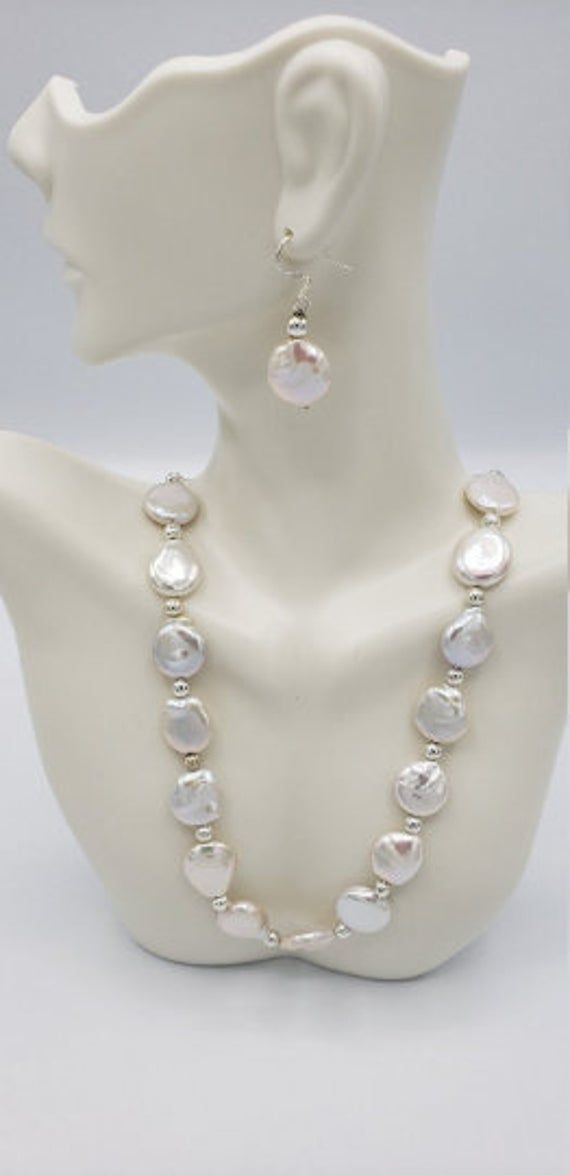 The Pearls has to stay in the Oyster long enough to get the thick Nacre, the wonderful white iridescent color and Rainbow Hue comes naturally with thick Nacre. Luxury, elegant ...The quality of these pearls is shown with the Beautiful Creamy White iridescent color that are glowing with iridescent. In addition to this, Nemali Jewelry designed this unique one of a kind necklace with 92.5 Silver combination. I hand pick every pearl in the necklace.I Will not pick pearls that are not cover with thic Wedding Jewelry With Round Mother Of Pearl Beads, Silver Baroque Pearl Wedding Jewelry, White Mother Of Pearl Jewelry For Wedding, Wedding Mother Of Pearl Necklace, White Single Strand Pearl Jewelry, Silver Single Strand Mother Of Pearl Jewelry, White Mother Of Pearl Jewelry With Pearl Drop, White Baroque Pearl Wedding Necklace, White Single Strand Mother Of Pearl Necklace