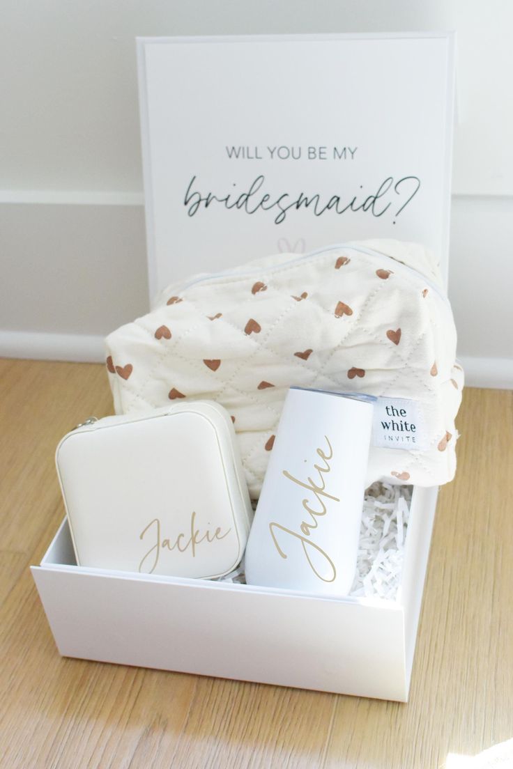 the bridesmaid gift box is filled with personalized items for her special day