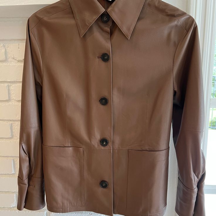 Vince Leather Shirt/ Jacket. Beautifully Made Lightweight 100% Leather Jacket That Can Also Be Worn As A Shirt. Bought From Bergdorfs 1 Month Ago And Haven’t Been Able To Wear. Like New Pristine Condition. Please See Pics For Measurements Or Vince Website. Designer Leather Jacket With Long Sleeves And Concealed Placket, Designer Leather Jacket With Concealed Placket, Designer Fall Tops With Lapel Collar, Fitted Leather Long Sleeve Tops, Fitted Button-up Leather Jacket For Office, Designer Collared Outerwear With Snap Buttons, Fitted Long Sleeve Leather Top, Fall Leather Jacket With Concealed Placket For Work, Tailored Leather Jacket With Hidden Button Closure